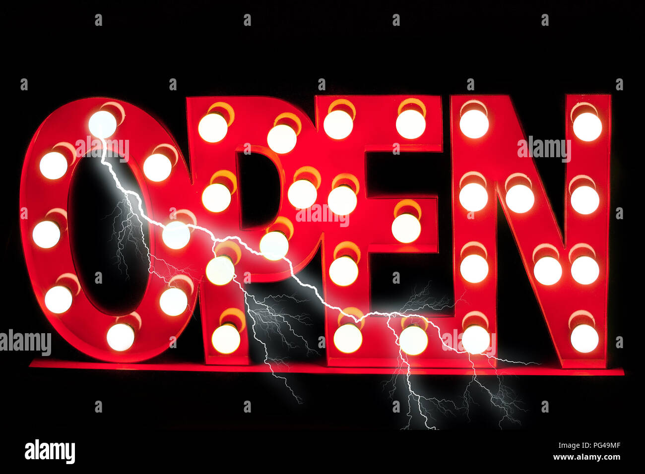 Luminous red color signboard Open decorated light bulbs with lightning effects on black background Stock Photo