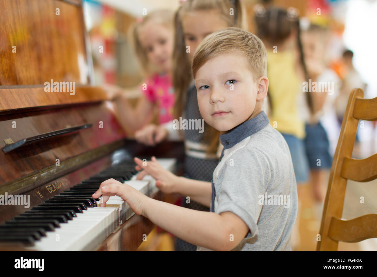 Belarus, Gomel, May 29, 2018. The kindergarten is central. Open Day.Child plays the piano.Preschool Music Education for Children Stock Photo