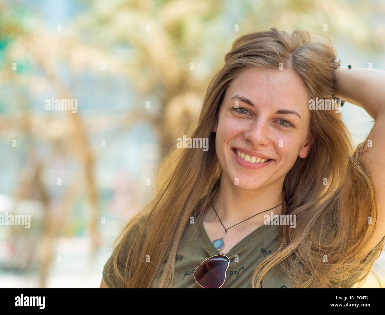 Portrait of a young and smiling girl in summer Stock Photo - Alamy
