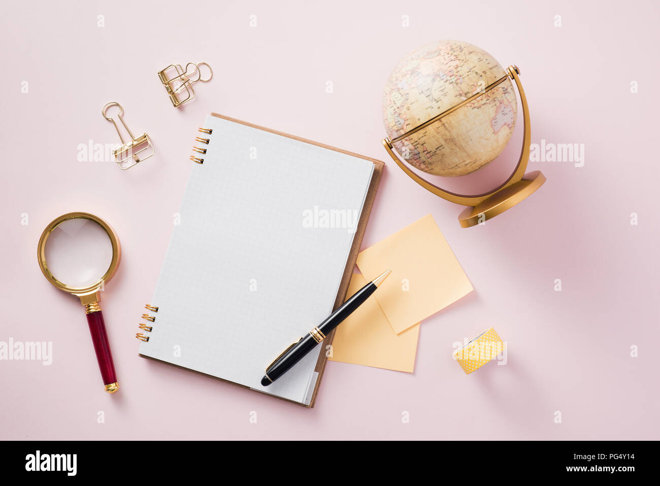 Modern mock up flat lay of notebook and stationery on pink background - Concept of creative work space Stock Photo