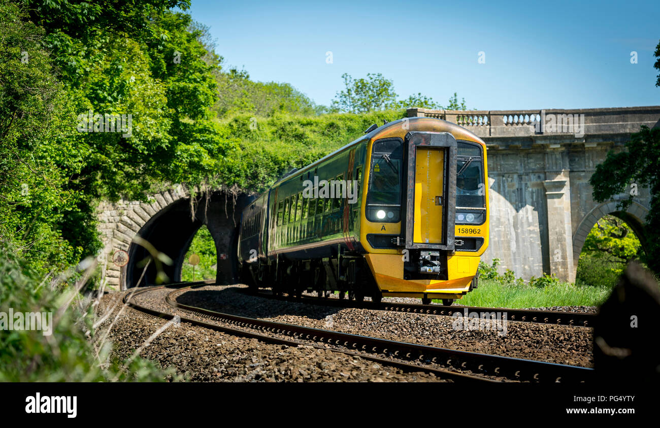 Class 158 express sprinter passenger train in First Great Western livery travelling to Portsmouth. Stock Photo