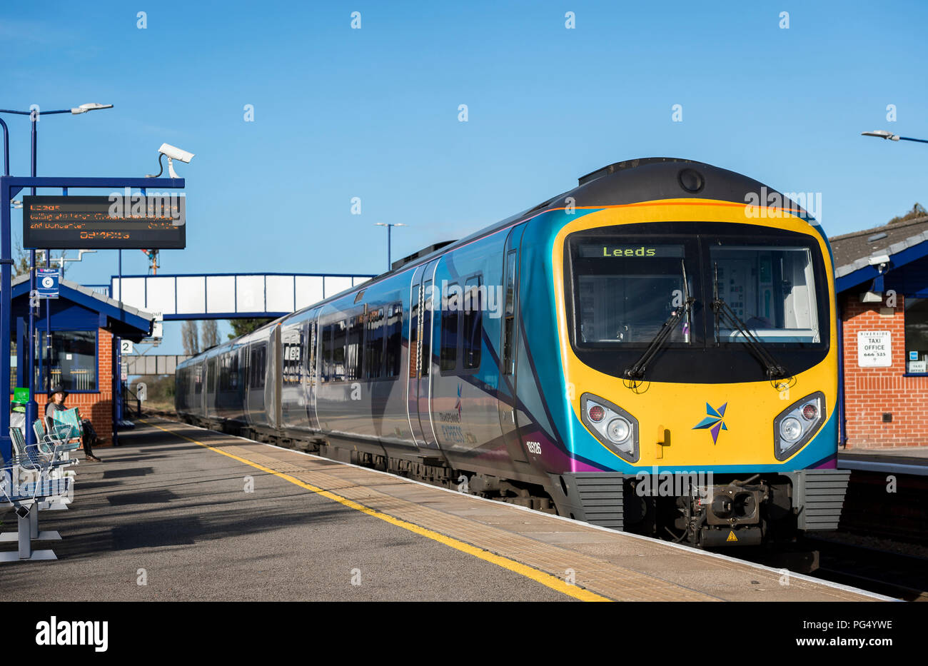 Transpennine Express Class 185 passenger train waiting at a platform at a railway station on it’s way to Leeds. Stock Photo