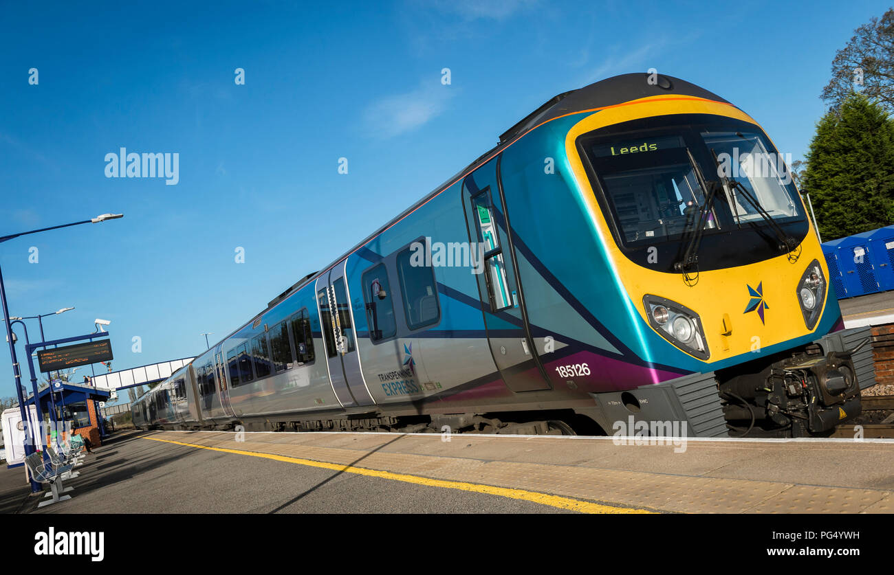 Transpennine Express Class 185 passenger train waiting at a platform at a railway station on it’s way to Leeds. Stock Photo