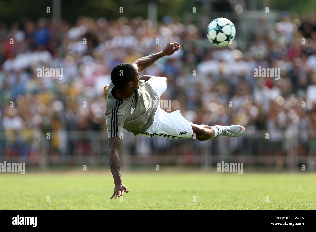 Douglas Costa  of Juventus FC in action during the pre-season friendly match between Juventus A and Juventus B. Stock Photo