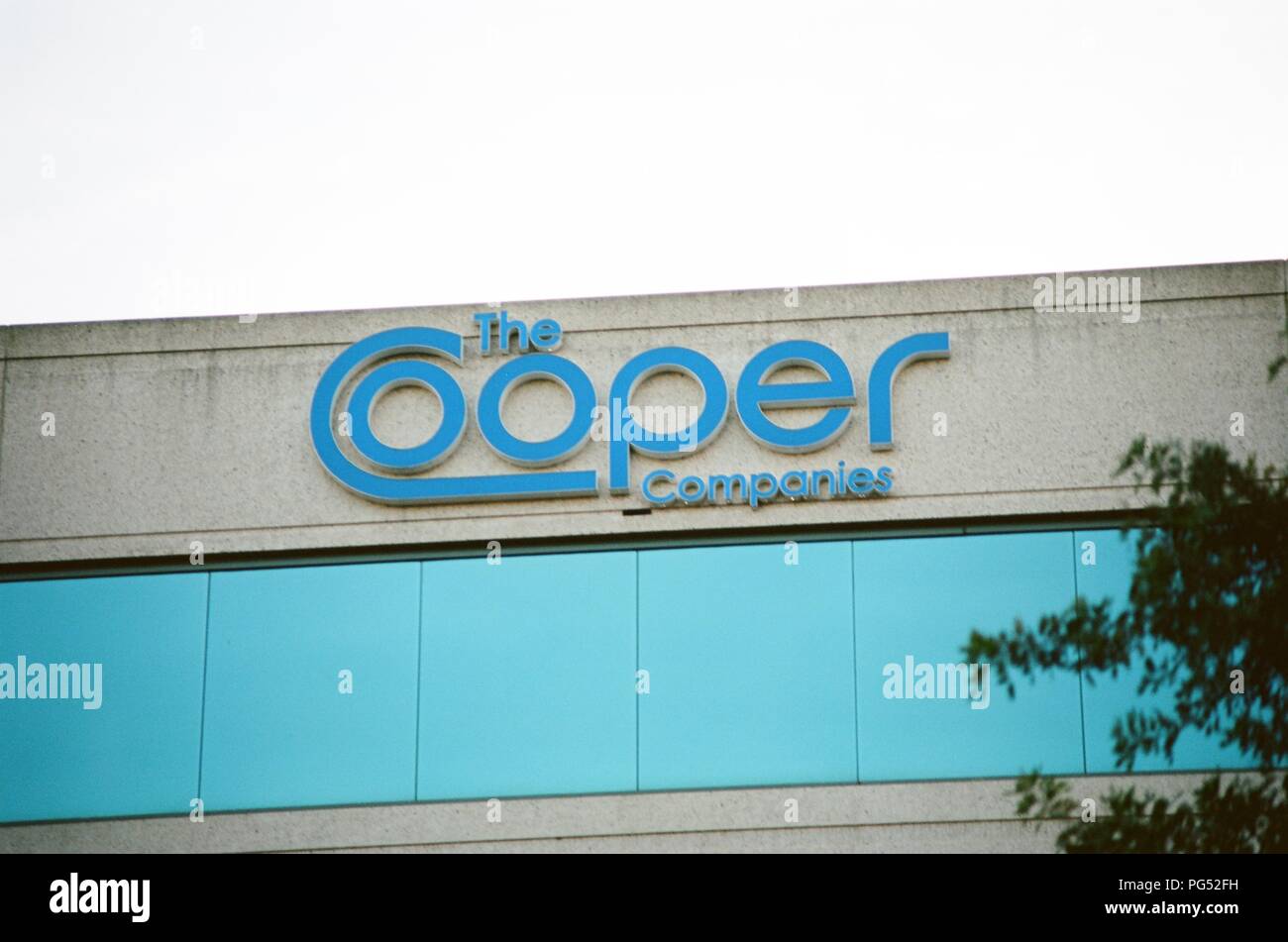 Close-up of sign with logo on facade of Cooper Companies in Pleasanton, California, March 26, 2018. () Stock Photo