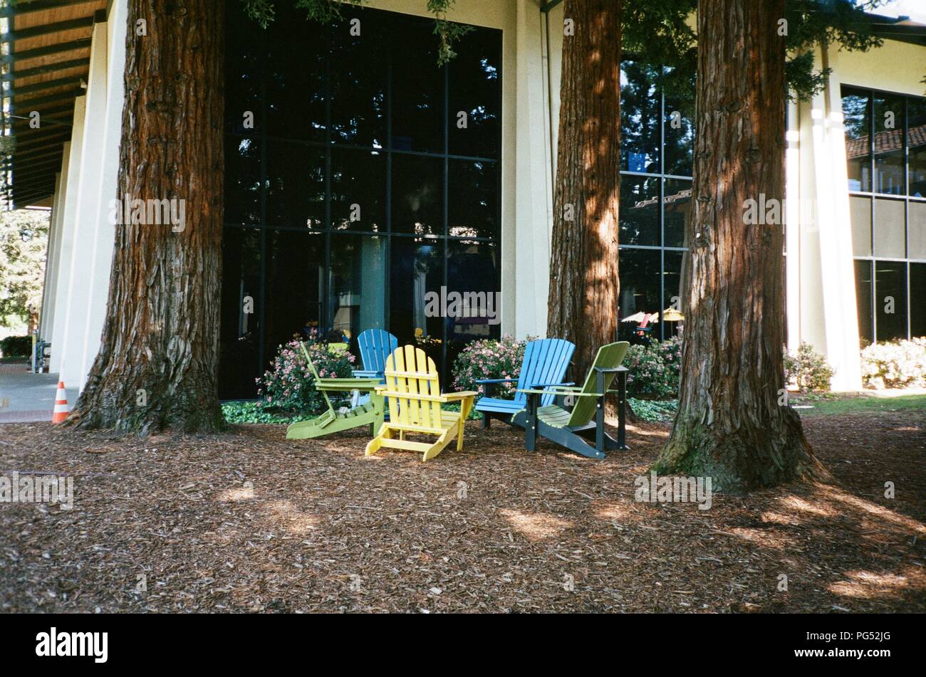 Colorful adirondack chairs in parent company Alphabet's colors are ...