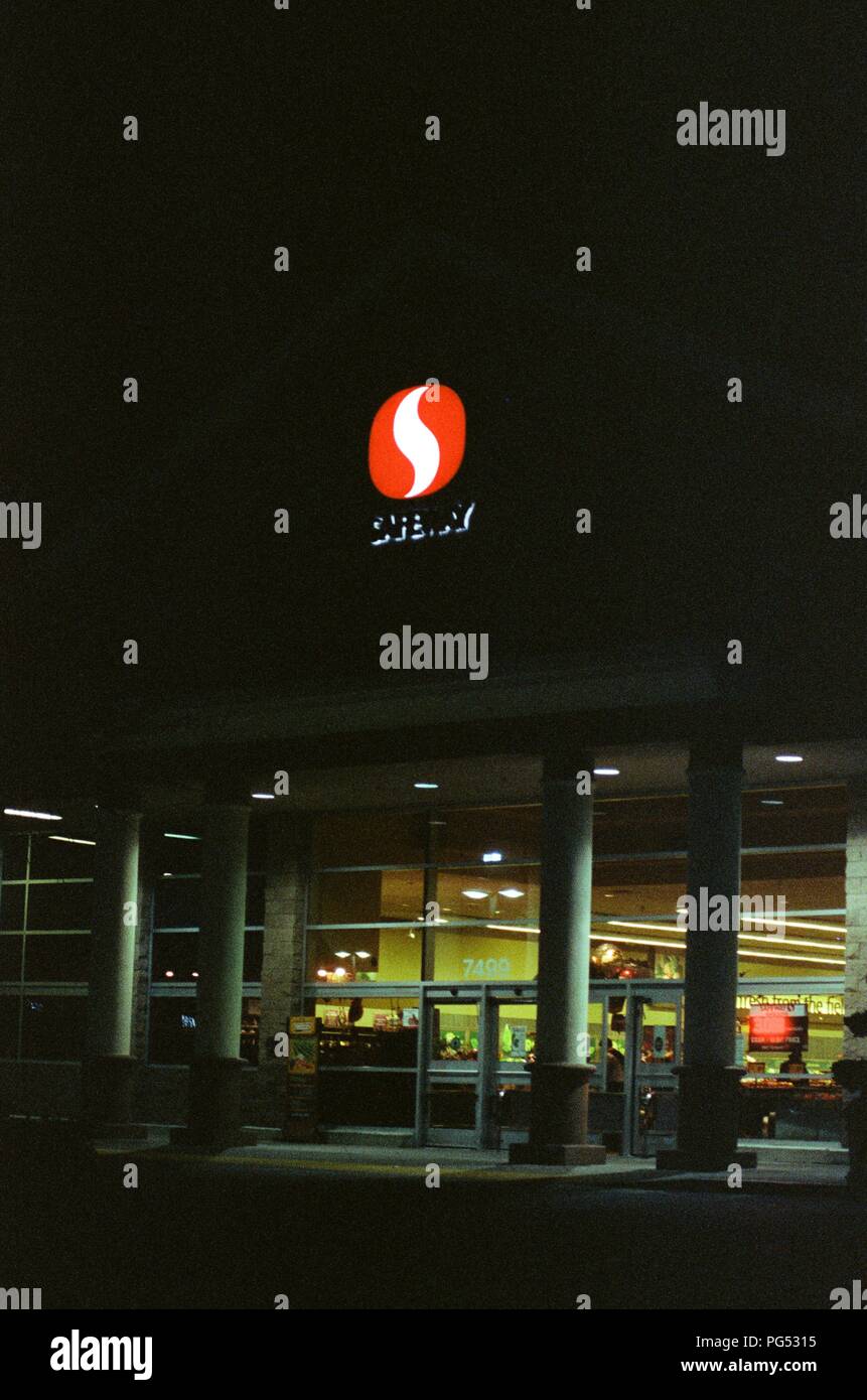 Entrance to Safeway supermarket at night with brightly lit sign and doors visible, Dublin, California, March 5, 2018. () Stock Photo