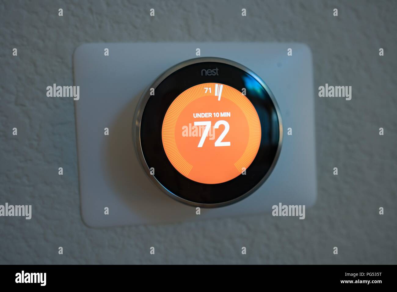 Close-up of third generation Nest Learning Thermostat from Google Inc, a smart home thermostat which automatically learns its users' behaviors, showing predictive function which predicts the time required to heat a house to a desired temperature, May 7, 2018. () Stock Photo