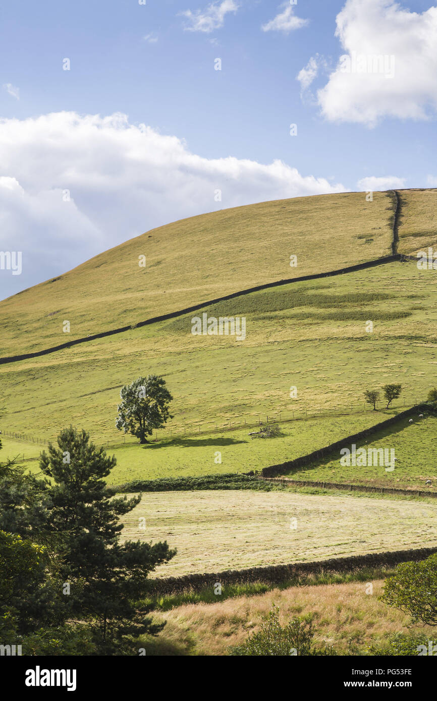 British countryside scene of hills and blue sky in Edale Valley, the Peak District, UK Stock Photo