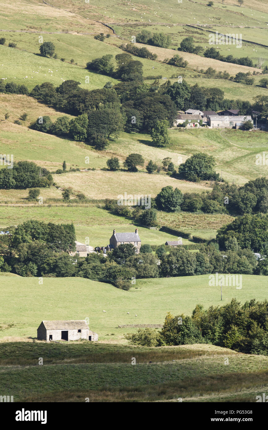 Typical rural England scene of rolling hills and farm houses in Derbyshire countryside Stock Photo