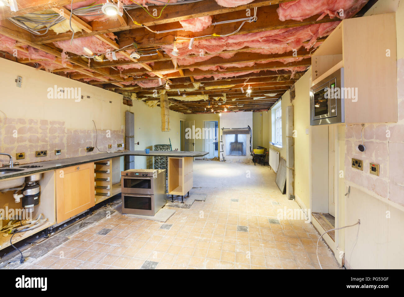 Kitchen removed in a rip out prior to renovation and replacement Stock Photo
