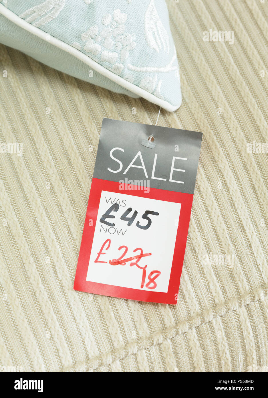Mock-up of price tag showing reduced price of a discounted product for sale in a retail store. Priced in pounds sterling for UK market Stock Photo