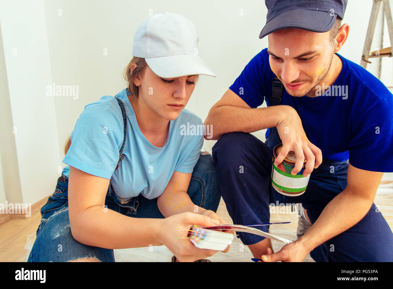 Cute girl holding color guide while choosing true color with her ...