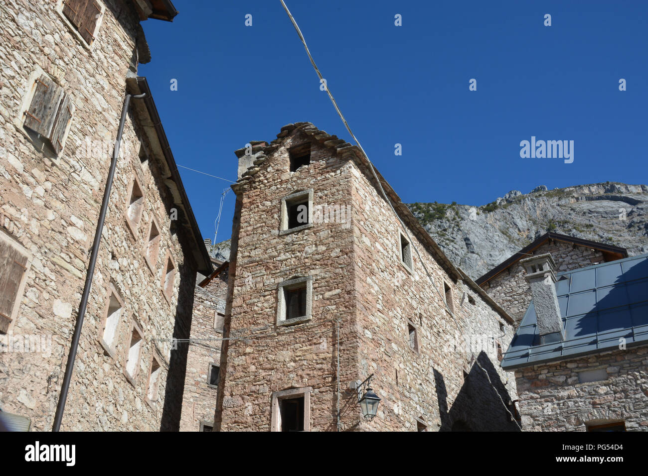the architecture of the houses in the vertical of the small town of Casso famous for the Vajont tragedy of October 1963 Stock Photo