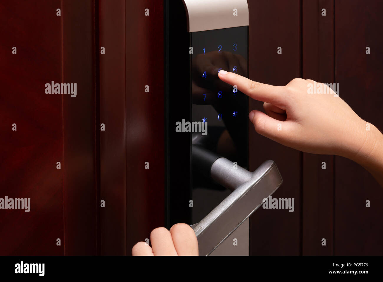 kid inputing passwords on an electronic door lock Stock Photo Alamy