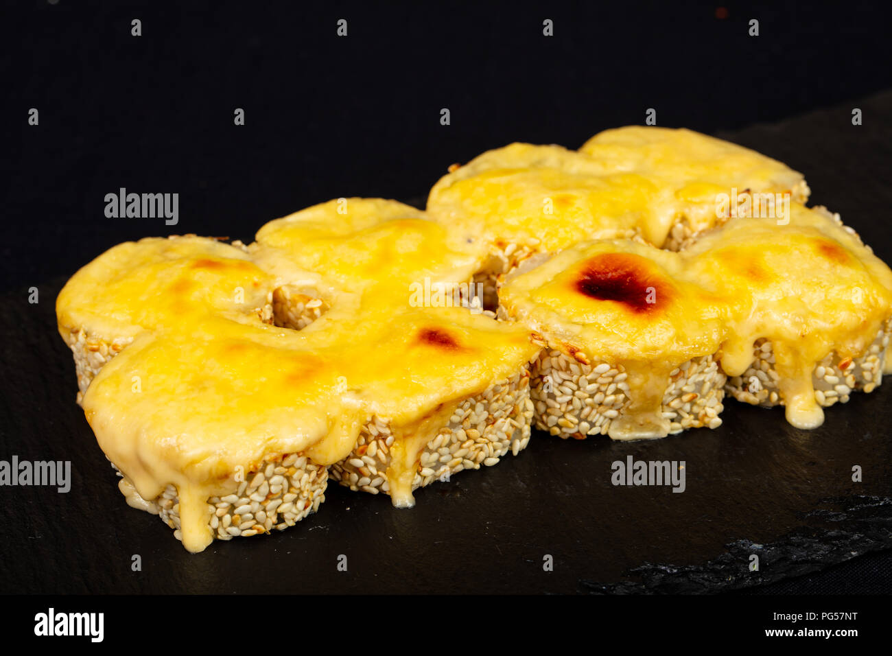 Baked Japanese roll with sauce Stock Photo Alamy