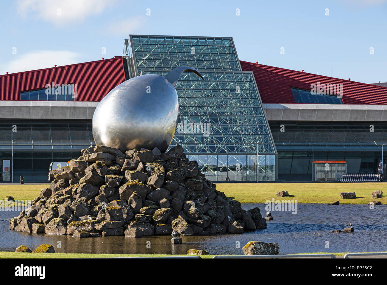 Keflavik International Airport near Reykjavik in Iceland. Abstract sculpture called The Jet Nest by Magnus Thomasson in front. Stock Photo