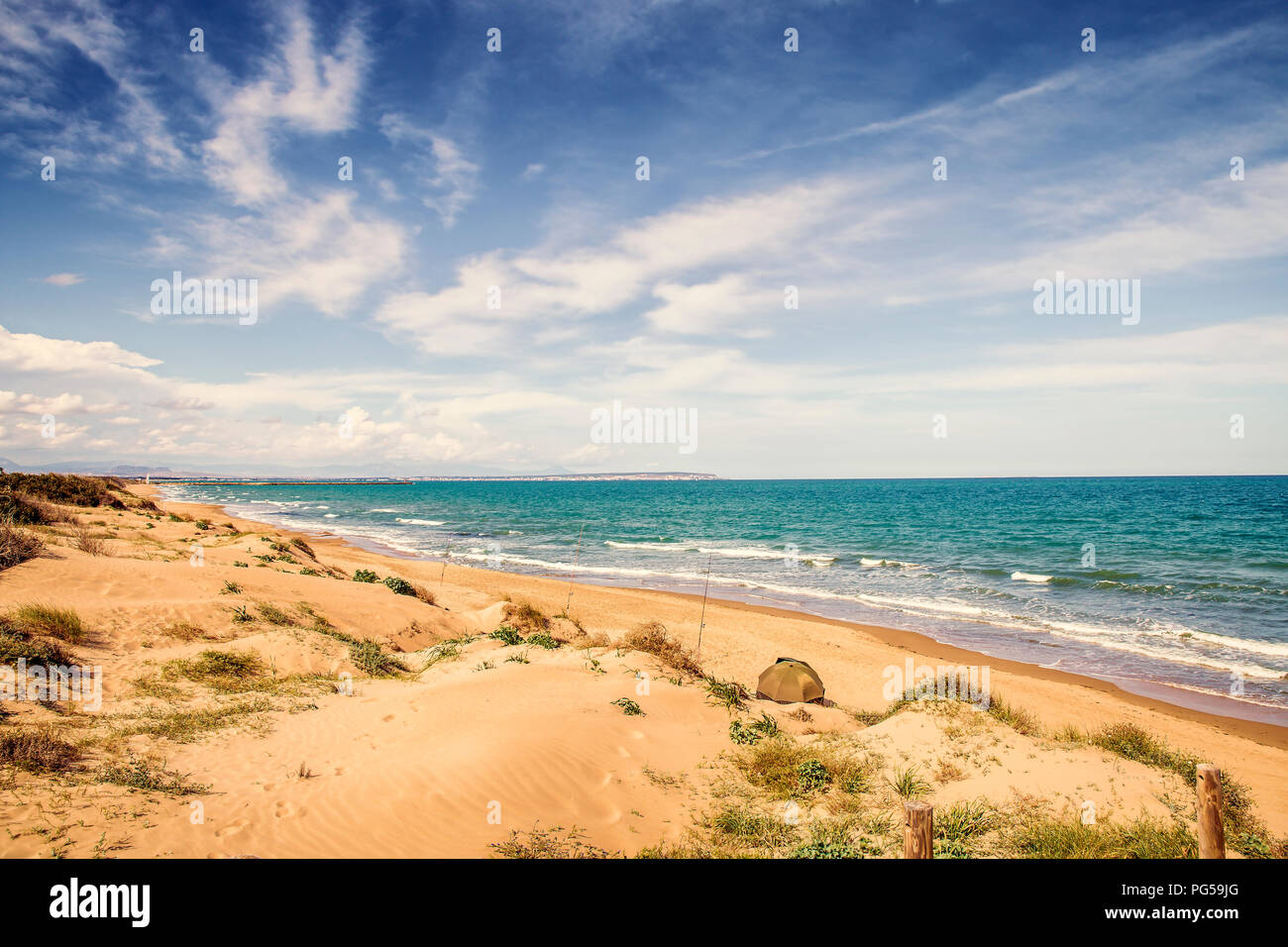 fishing in solitude Guardamar del Segura Beach with sand dunes.Alicante, Spain Stock Photo
