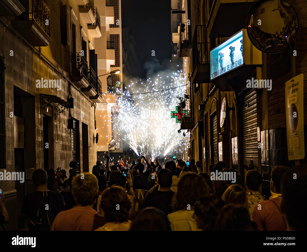 Barcelona, Spain. August 22, 2018 - People celebrating in the Fire Run 'Correfoc' ritual in Gracia Festival in Barcelona Stock Photo
