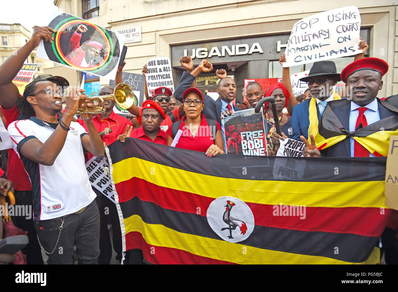Ugandans protest outside Uganda House in Trafalgar Square, London, after Ugandan pop star-turned-politician Bobi Wine was charged with treason in a civilian court, minutes after a military court dropped weapons charges. Stock Photo