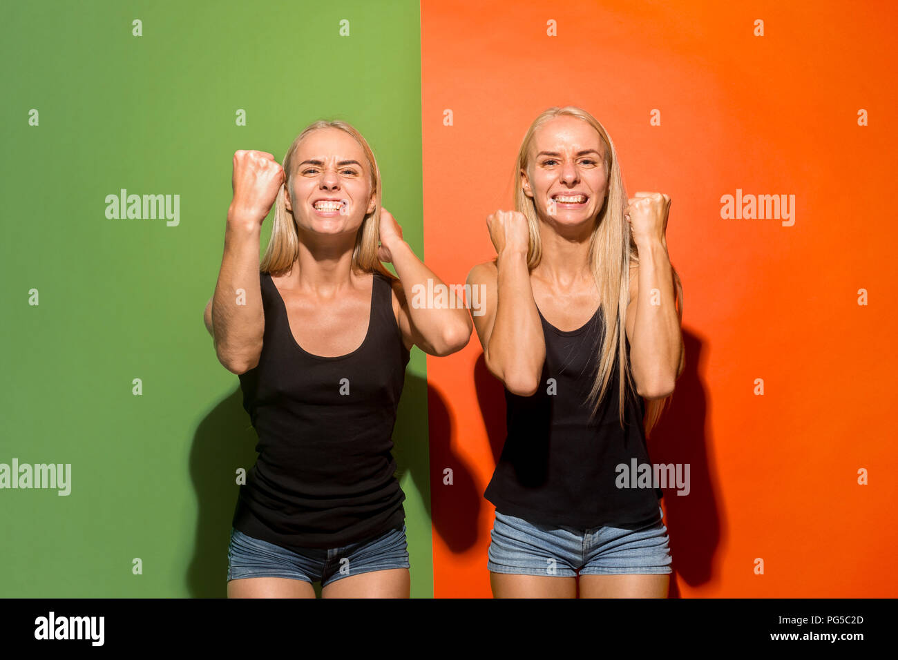 I won. Winning success happy women celebrating being a winner. Dynamic image of caucasian female model on studio background. Victory, delight concept. Human facial emotions concept. Trendy colors Stock Photo