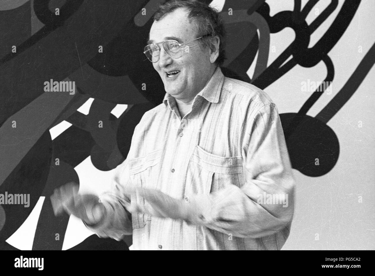 The Czech painter Zdenek Sykora in his studio in Louny. Sykora used a computer for the composition arrangements of his paintings, which he then transferred to the canvas in acrylic. From 1966 he was a lecturer at the Charles University in Prague. Stock Photo