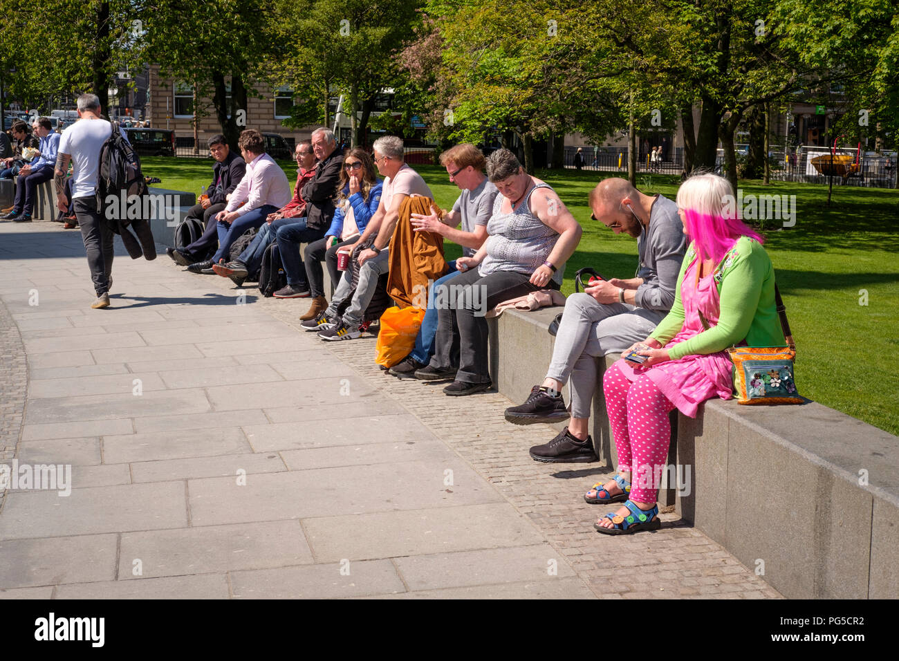 People enjoying the sunshine, St Andrew Square gardens, Edinburgh ...