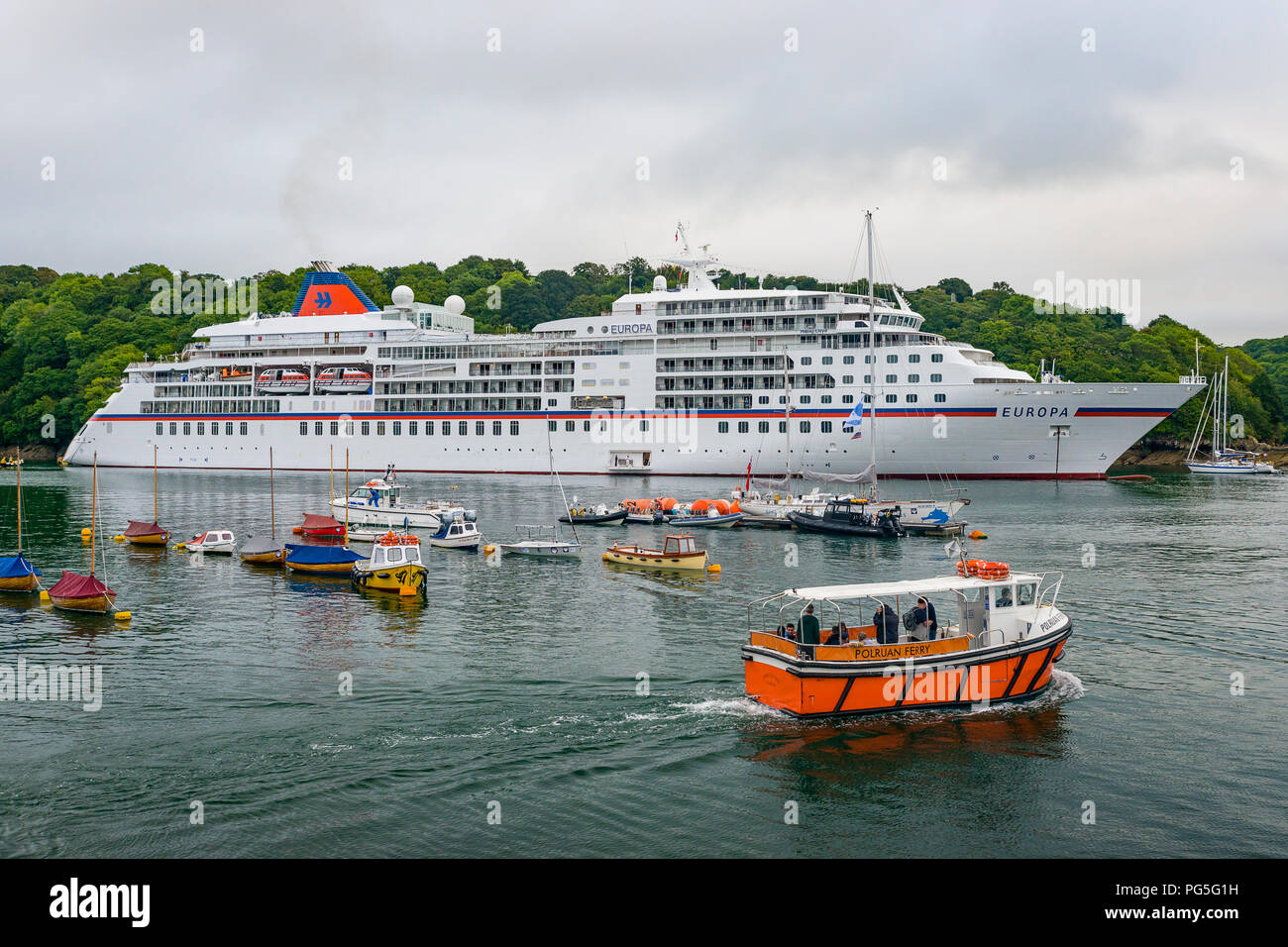 Editorial: Members of the Public, Potential Logos. Fowey, Cornwall, UK 20/082018. Luxury Cruise ship the Europa drops anchor in Fowey on it's way back Stock Photo