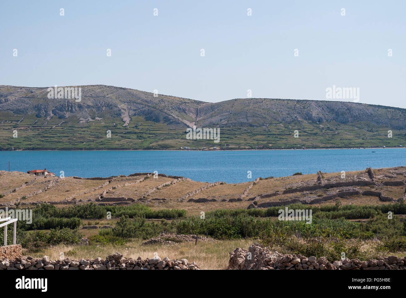 Croatia: panoramic view of the fjord and village of Metajna, a remote little village along the Bay of Pag on the Island of Pag in the Adriatic Sea Stock Photo