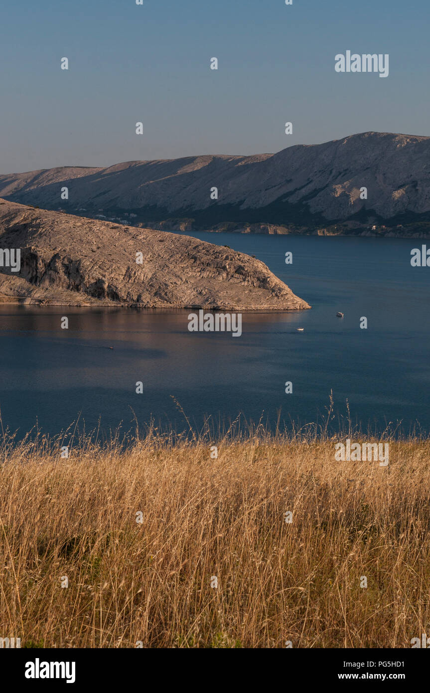 Croatia: panoramic view of the fjord and village of Metajna, a remote little village along the Bay of Pag on the Island of Pag in the Adriatic Sea Stock Photo