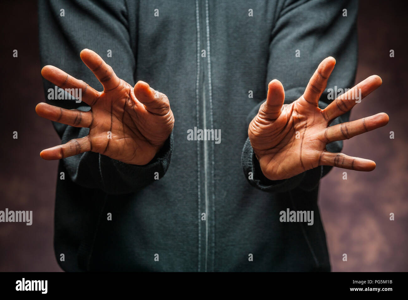 Portrait of a pair of dark complexioned / African American / black  male hands. Stock Photo
