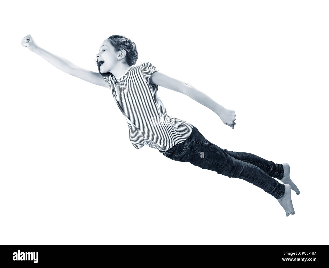 Little girl flying in the superman pose. Stock Photo