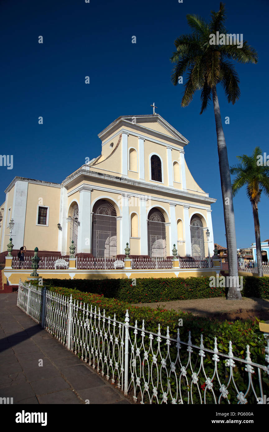 Angled view looking up at the front facade of the Iglesia Parroquial de la Santisima Trinidad church in the Plaza Major Trinidad Cuba Stock Photo