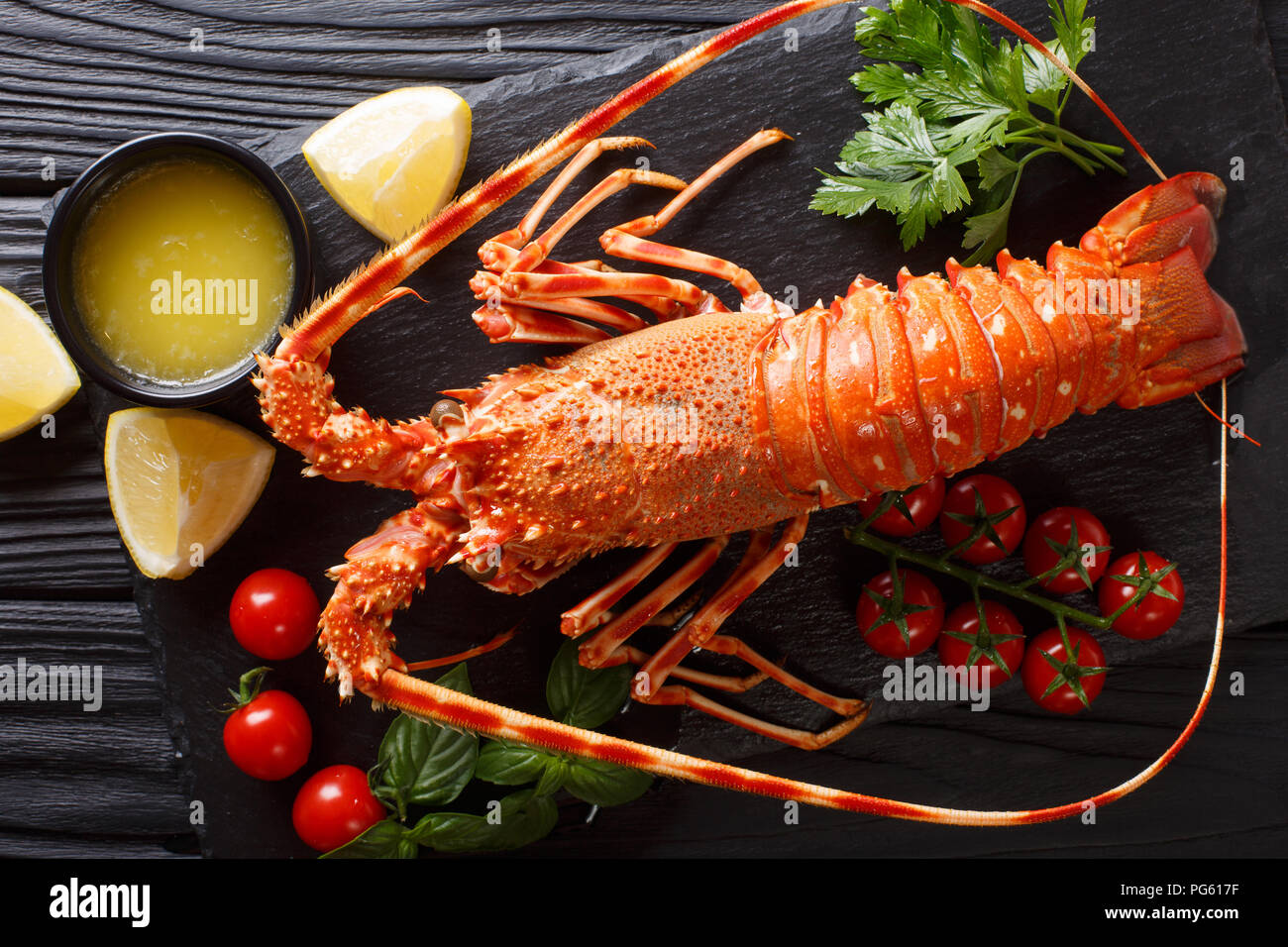 Delicious food: boiled spiny or rocky lobster with tomato, lemon and ...