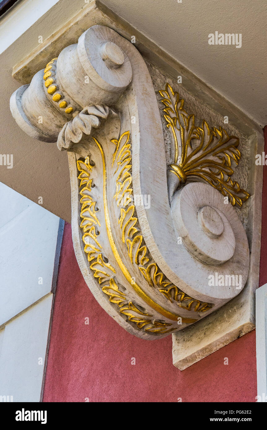 A balcony support in stone and gold paint, in the renaissance old town in Poznań (Poznan), Poland Stock Photo