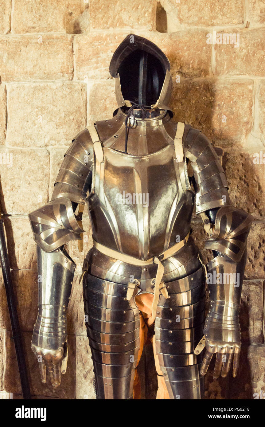 A suit of armour in Bamburgh Castle, Northumberland, England, UK Stock Photo