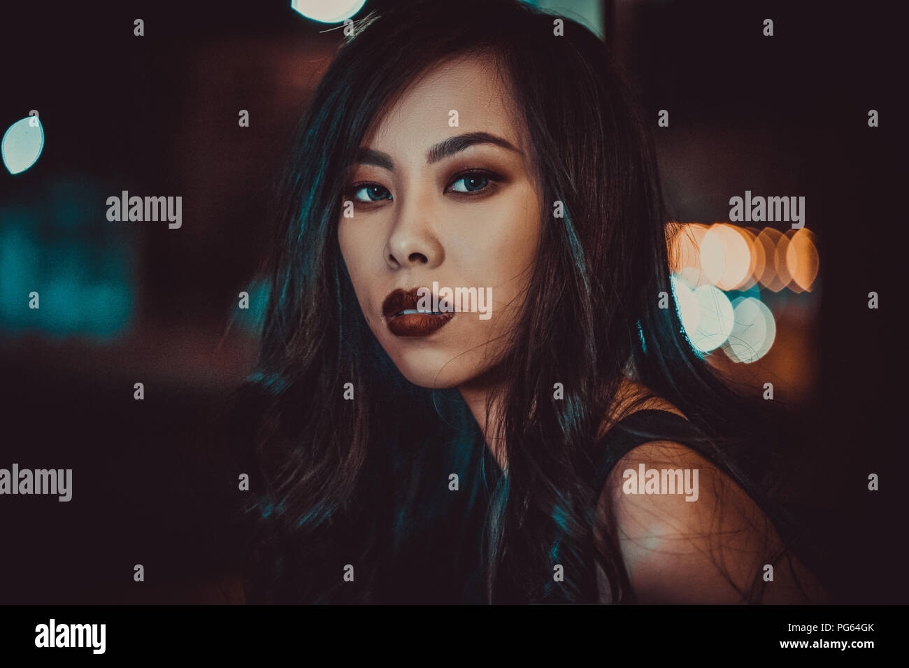 Night portrait of young asian woman Stock Photo - Alamy