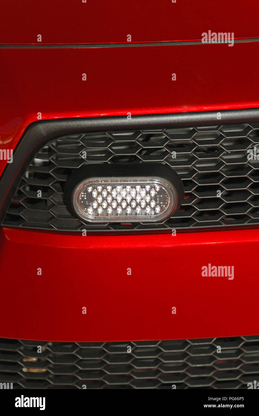 LED lights at red car grille Stock Photo Alamy