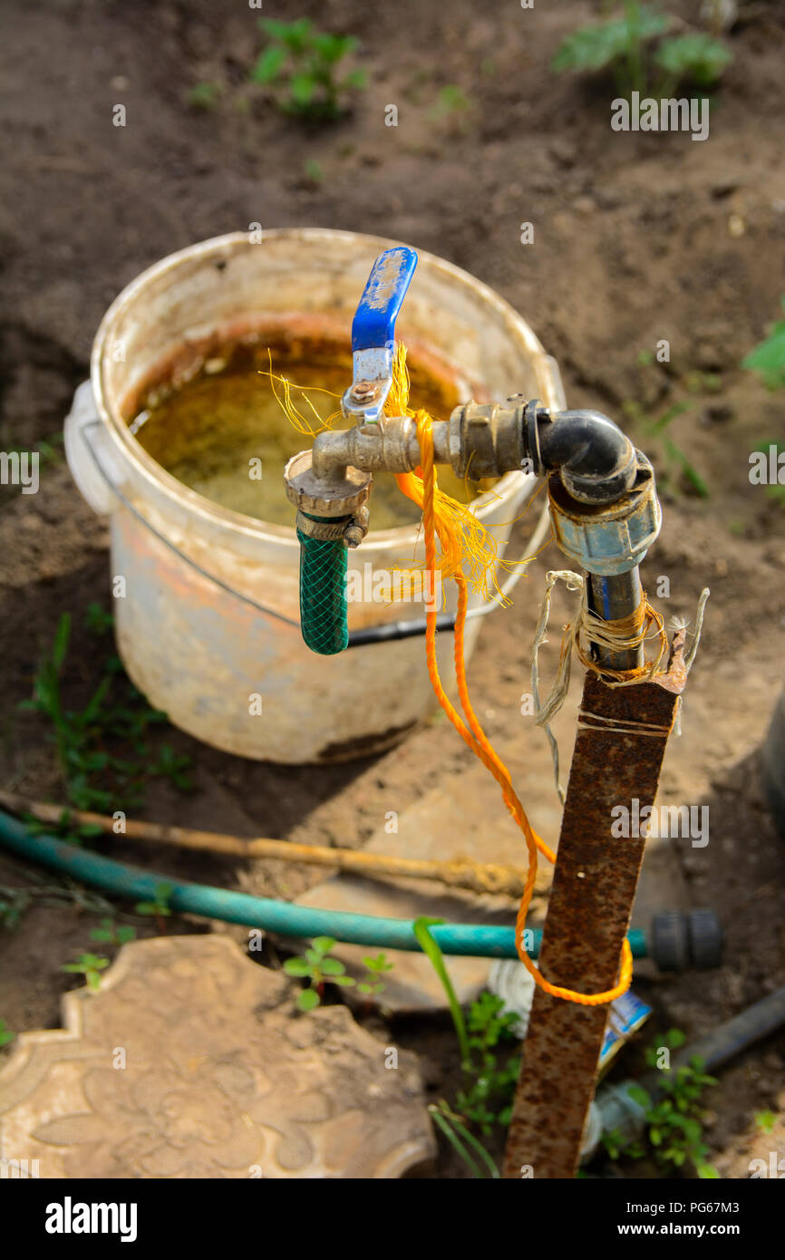 An original irrigation system consisting of a bucket with a crane