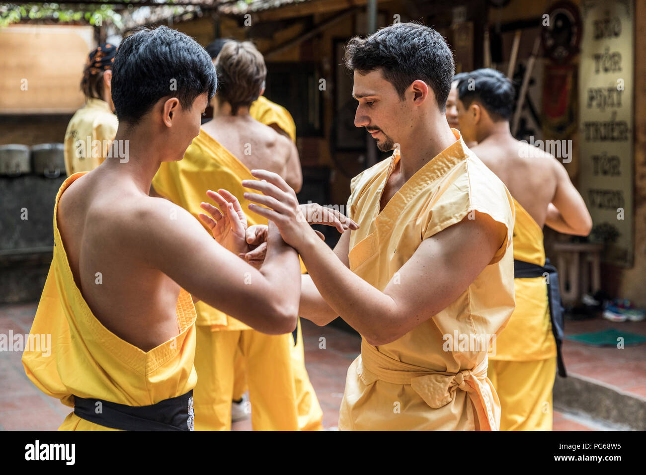 Vietnam, Hanoi, men exercising kung fu Stock Photo Alamy