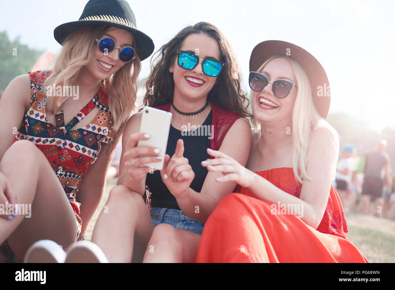 Happy friends making selfie at music festival Stock Photo
