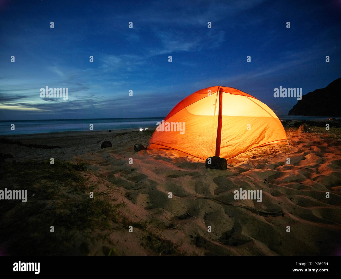 USA, Hawaii, Kauai, Polihale State Park, illuminated tent on the beach at night Stock Photo