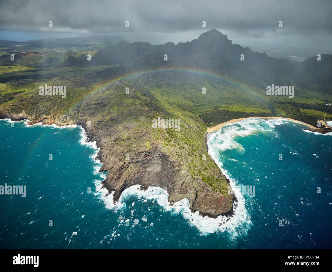 USA, Hawaii, Kauai, rainbow over Na Pali Coast, aerial view Stock Photo