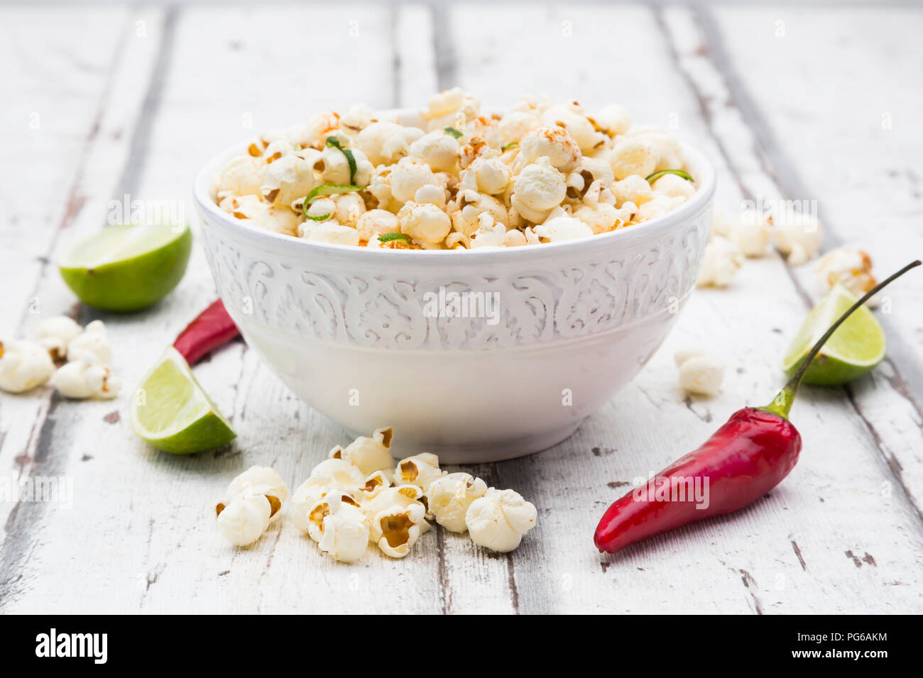Bowl of popcorn flavoured with chili and lime Stock Photo