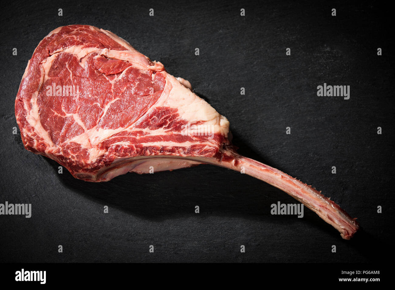 Raw tomahawk steak Stock Photo