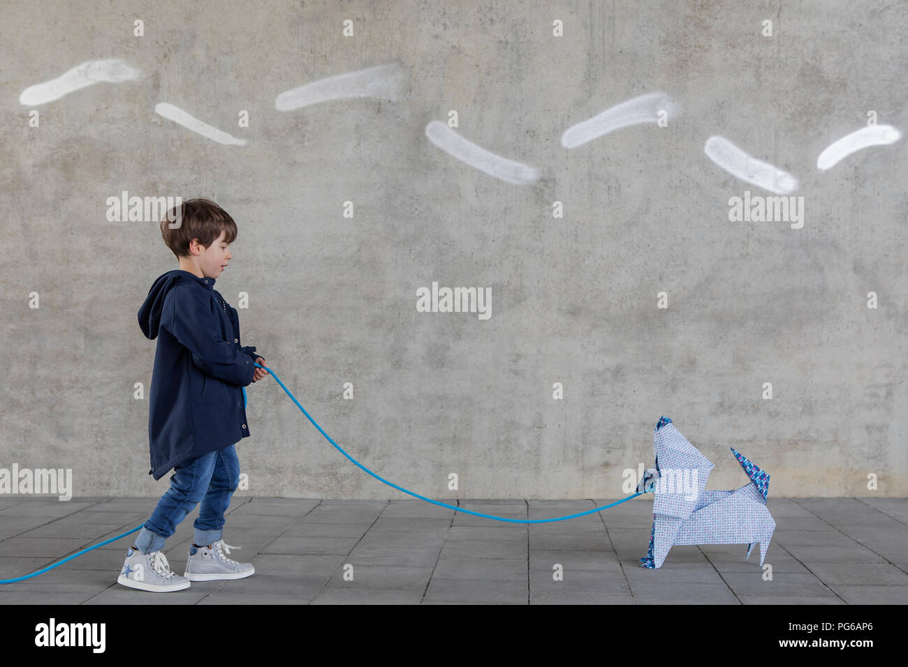 Little boy with origami dog Stock Photo