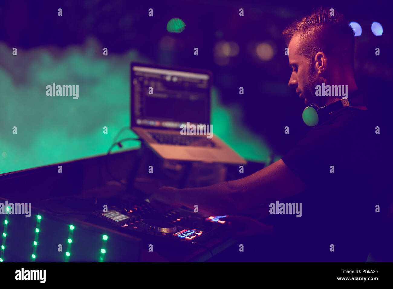 Dj mixes the track in the at party. DJ hands in motion Stock Photo Alamy