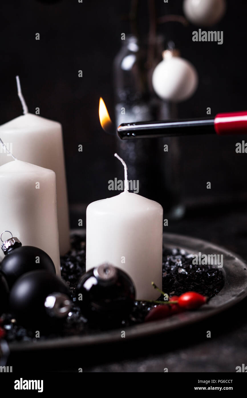 Lighting Advent candle Stock Photo Alamy