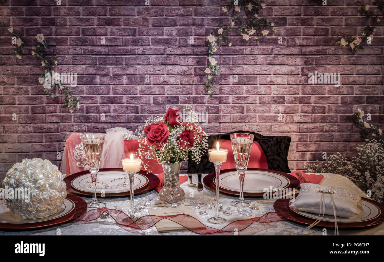 Bride And Groom Place Settings At Head Table At Reception Stock