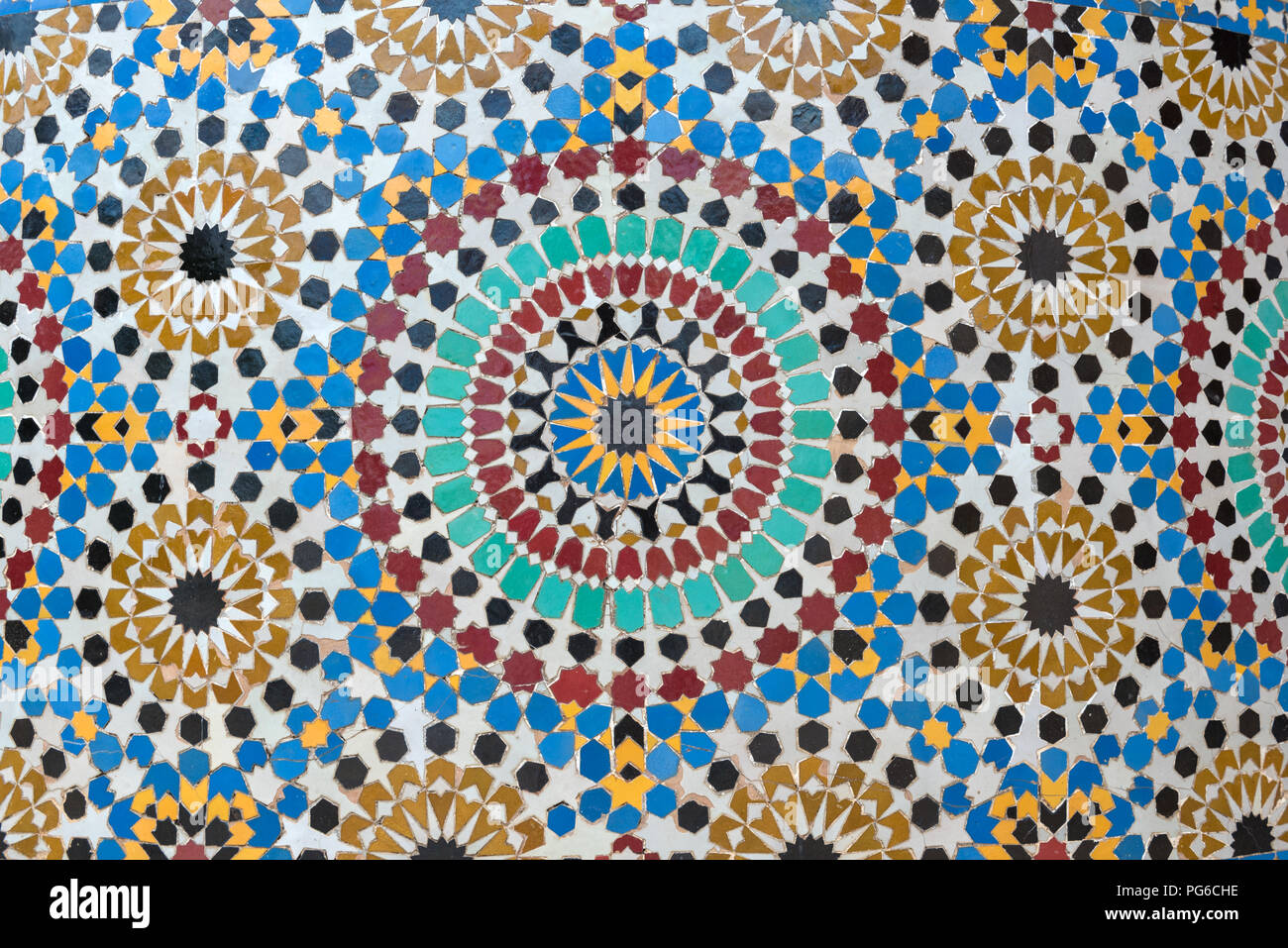 Arabic mosque tiles. Traditional colourful islamic pattern on an ablution at Tour Hassan, Rabat, Morocco Stock Photo